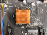 a close up of a computer motherboard with wires attached to it