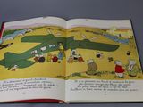 an open book with a picture of a plane on it