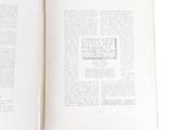 an open book with a picture of a cat on it