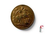 une pièce d'or sur laquelle figure l'effigie d'un homme à cheval