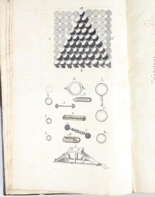 an open book with drawings of various objects in it on a table