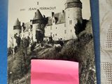 a pink post - it note with a picture of a castle on it