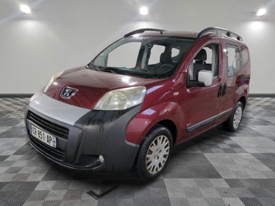 a picture of a small red van parked in a room
