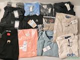 a lot of men ' s shirts on a table