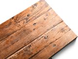 a close up of a piece of wood on a white surface
