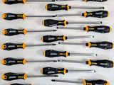 a bunch of screwdrivers sitting on top of a white surface