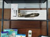 a shelf with a cell phone and other items on it