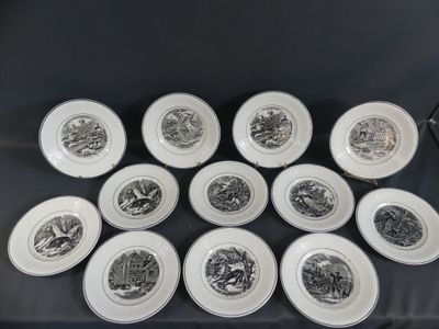 six plates with black and white designs on them on a table