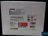 the back of a white box with a red and black sticker on it