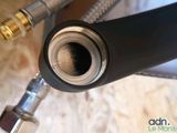 a close up of a hose with a hose attached to it