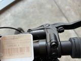 a close up of a bicycle handlebar with a tag attached to it