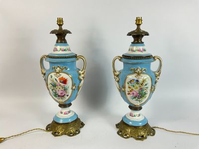 pair of blue and gold vases with flowers and birds on them
