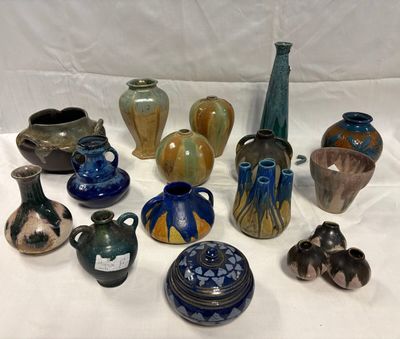 many different vases that are sitting on a table