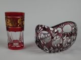 two glass vases sitting next to each other on a table
