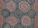 a close up of a black and red artwork with circles