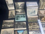 a lot of old postcards sitting on a table