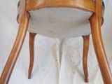 a wooden chair with a seat made of wood and fabric