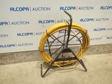 an image of a yellow hose sitting on top of a metal stand