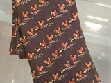 a tie that is on display in a clear box