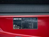 a close up view of a red car ' s rear end