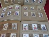 an open book with pictures of people on it on a table
