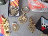 a lot of medals and other items on a table