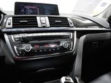 the interior of a car with a dashboard, radio, and steering wheel