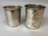 pair of silver plated cups with handles