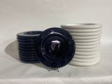 a stack of plates and bowls on a table