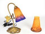 two lamps that are sitting on a white surface