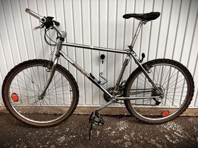 a bike that is parked against a wall