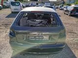 a car that has been left in the lot with its hood open