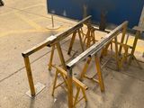 several pieces of wood sit on top of a table in a warehouse