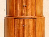 an image of a wooden cabinet against a wall