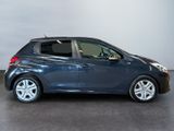 a blue car is parked in a room with a white wall