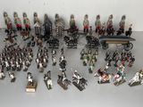 many figurines of soldiers on display on a table