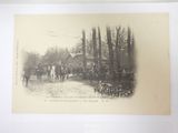 a black and white photo of a group of people riding horses
