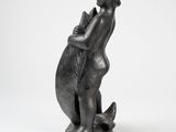 an image of a statue of a woman holding a cat