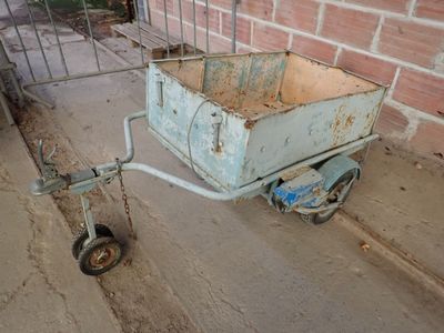 a small cart that is sitting on the side of the street