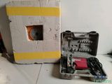a box that has a tool in it on a table