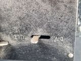 a close up of a piece of metal with a hole in it