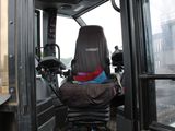 a seat in the back of a bus with a bag on it
