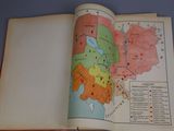an open book with a map of the world on it