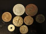 a lot of coins that are on the table
