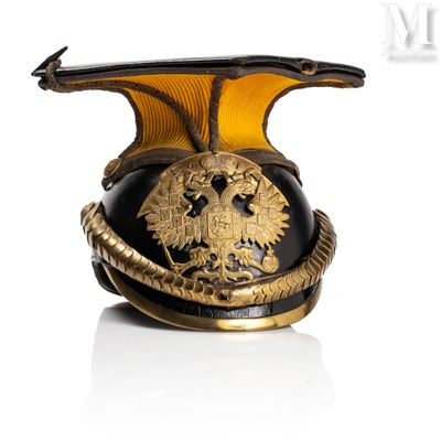 a black and gold helmet with a gold eagle on it