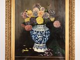 peinture d'un vase de fleurs sur une table dans un cadre doré