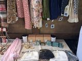 many different types of clothing displayed on a table