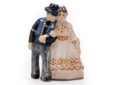a figurine of a man and a woman standing next to each other