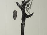 a black and white drawing of a bird on a branch