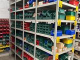 many bins and boxes on the shelves in the warehouse